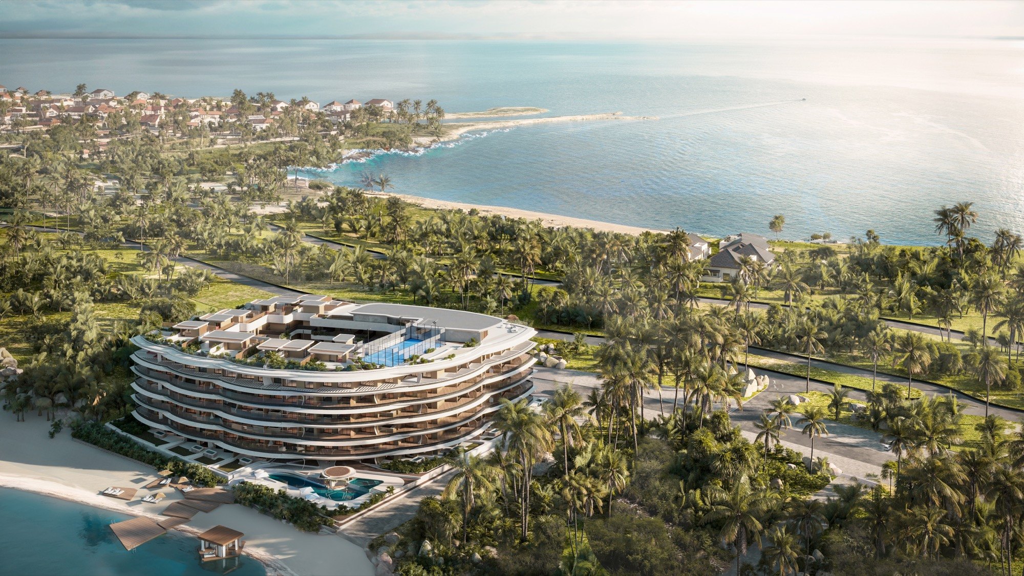 An aerial rendering of Puerto Marina in Cap Cana showing its lake beach, pools and the ocean beyond; the sea lies 660 ft from the building.