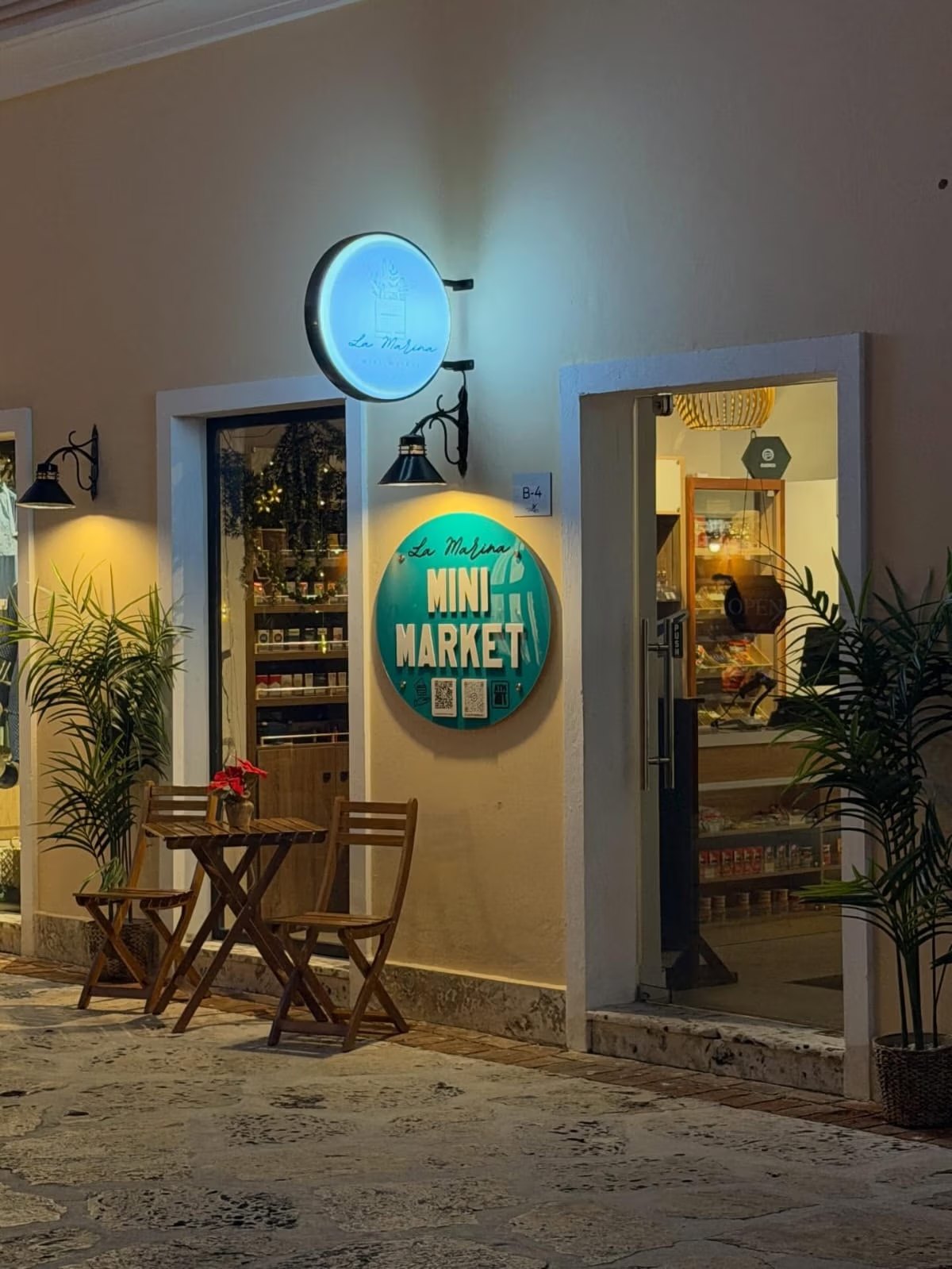 Photograph of a mini market at night in the Cap Cana community around Puerto Marina, which sits a 3-minute drive from Cap Cana Marina.